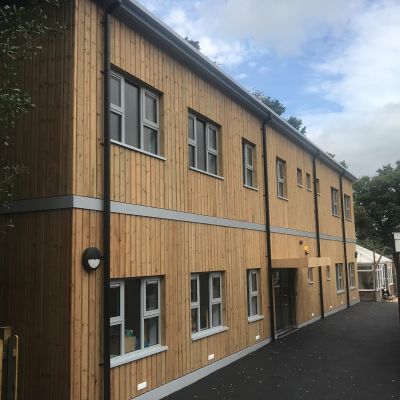 Vertical European red wood timber cladding